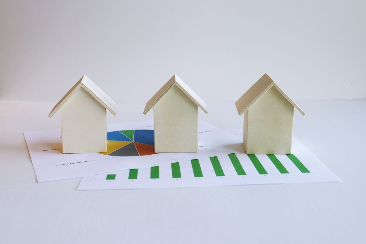 Model houses on top of investment graphs