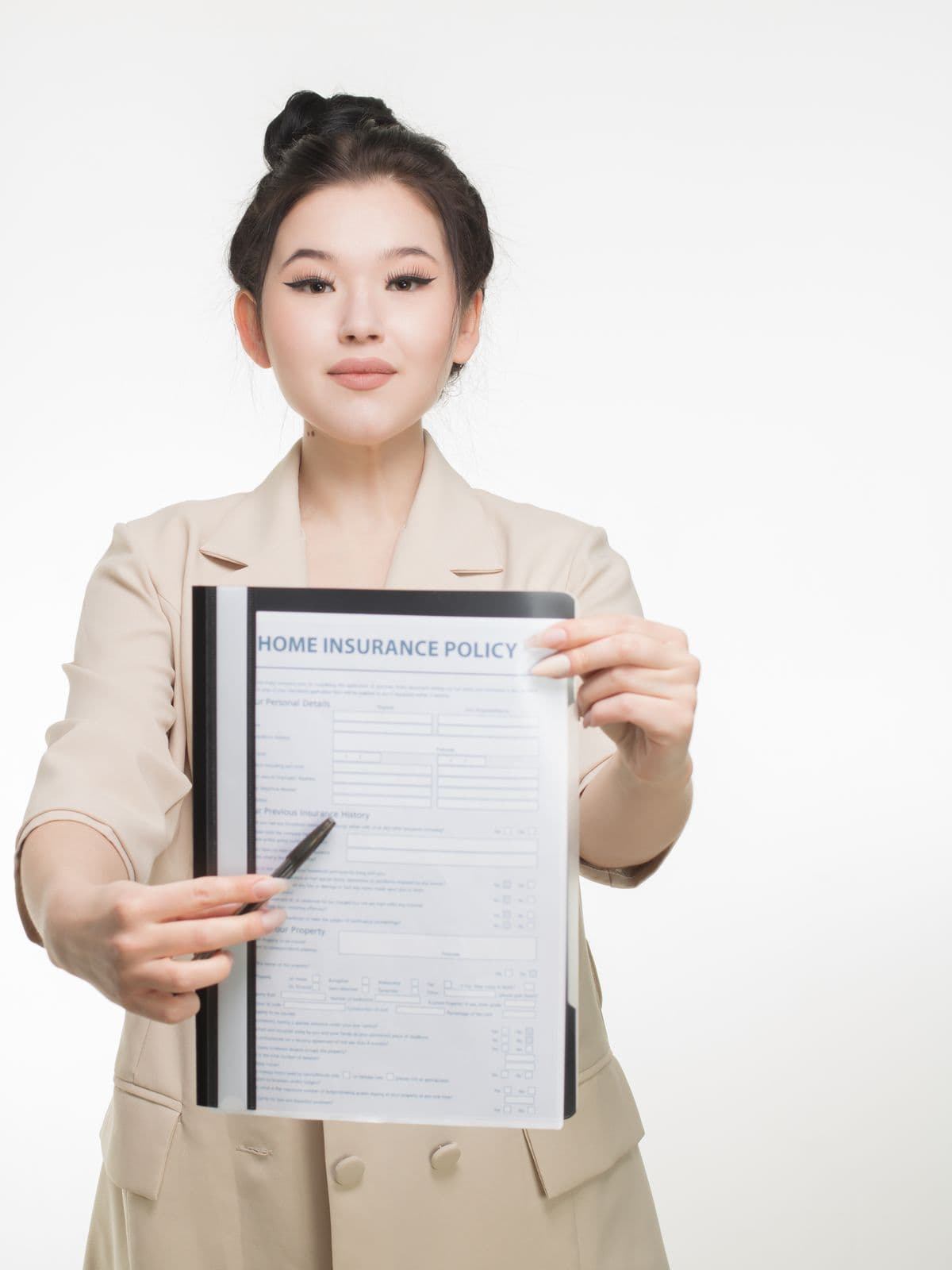 Broker holding an insurance policy document